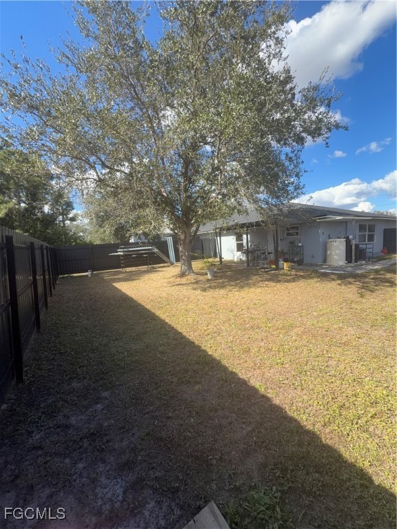 4427 25th Street Southwest Lehigh Acres, FL 33973 - Photo 18 of 20 a view of swimming pool in front of residential houses with outdoor space