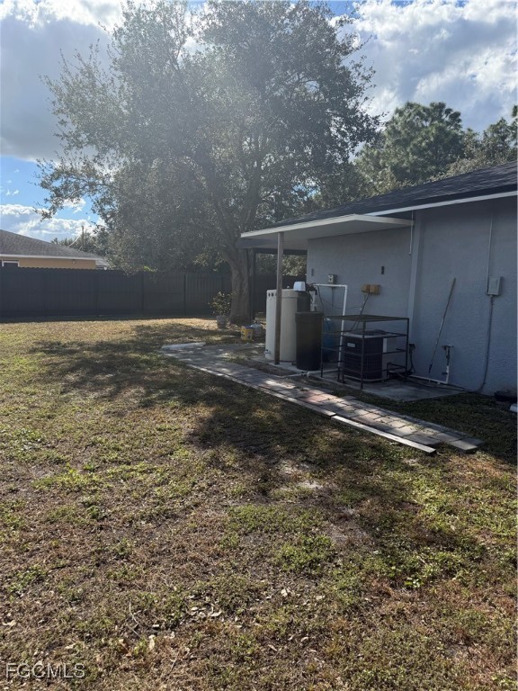 4427 25th Street Southwest Lehigh Acres, FL 33973 - Photo 19 of 20 a view of a back yard of the house