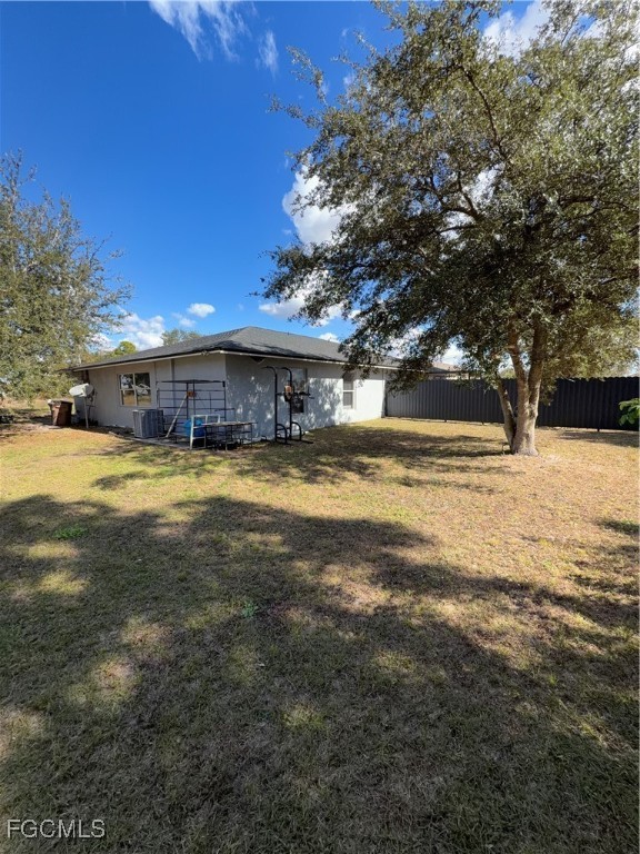 4427 25th Street Southwest Lehigh Acres, FL 33973 - Photo 20 of 20 a view of a swimming pool with an outdoor space and seating area