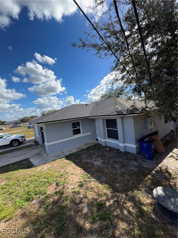 4427 25th Street Southwest Lehigh Acres, FL 33973 - Photo 2 of 20 a house view with a backyard space