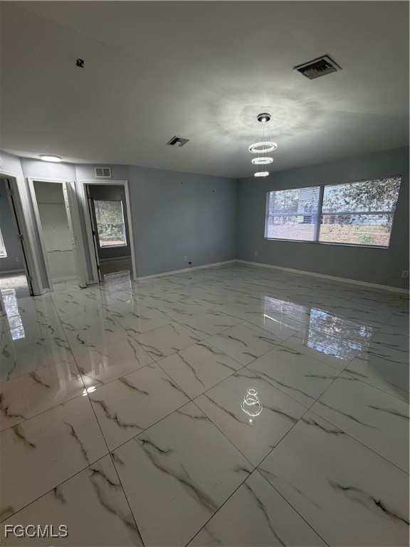 4427 25th Street Southwest Lehigh Acres, FL 33973 - Photo 5 of 20 a view of an empty room