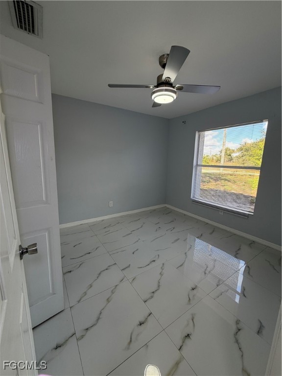 4427 25th Street Southwest Lehigh Acres, FL 33973 - Photo 7 of 20 a view of an empty room with a window