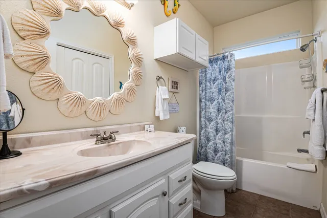 a bathroom with a sink a toilet and a bathtub