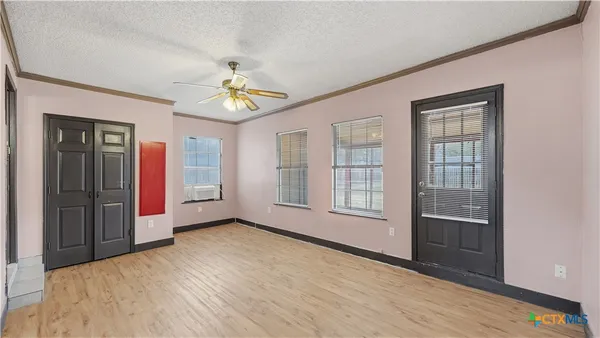a view of an empty room with a window