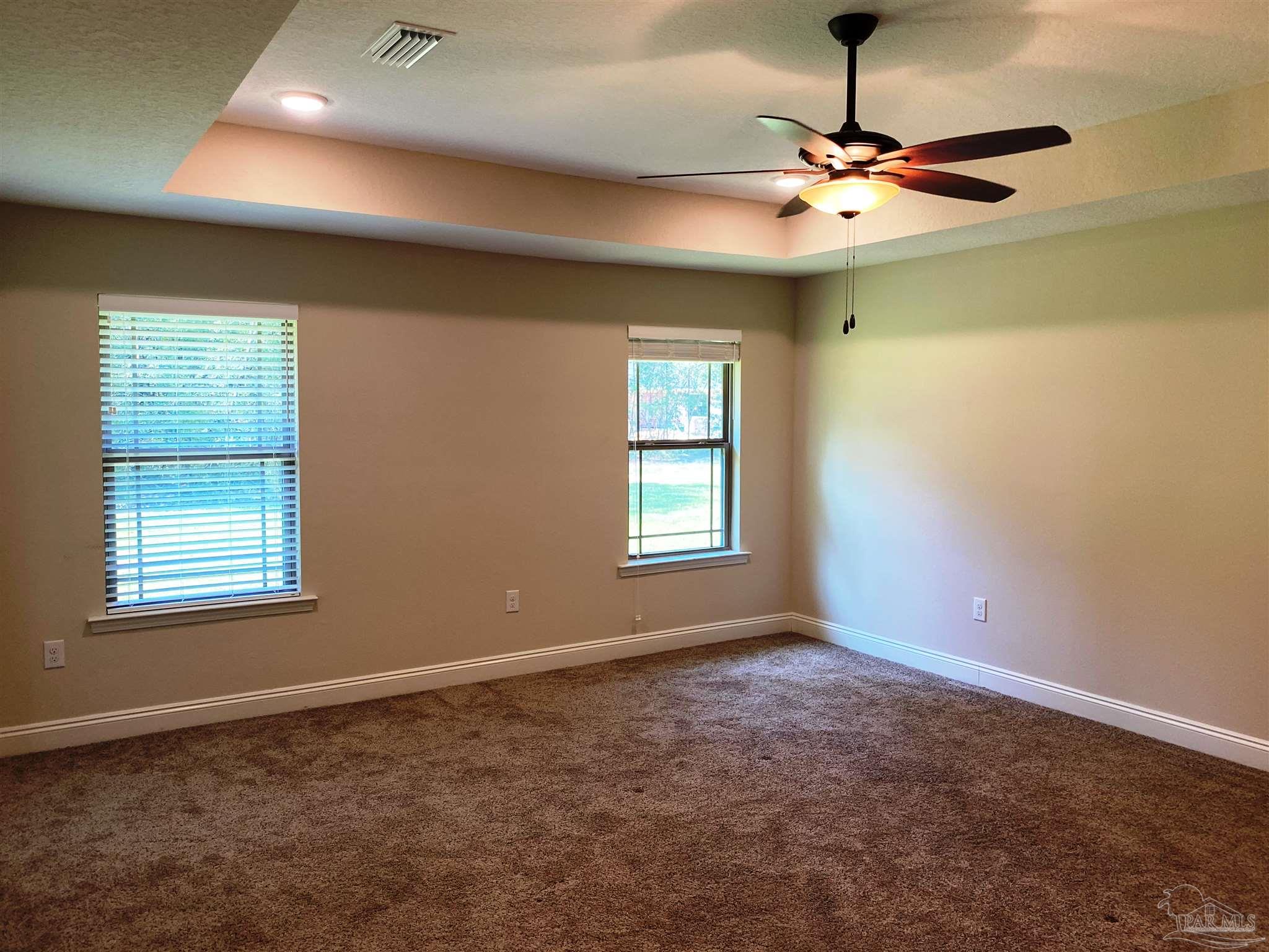 5472 South A Jones Road Milton, FL 32583 - Photo 11 of 29 Master bedroom has a box ceiling w/fan/light.