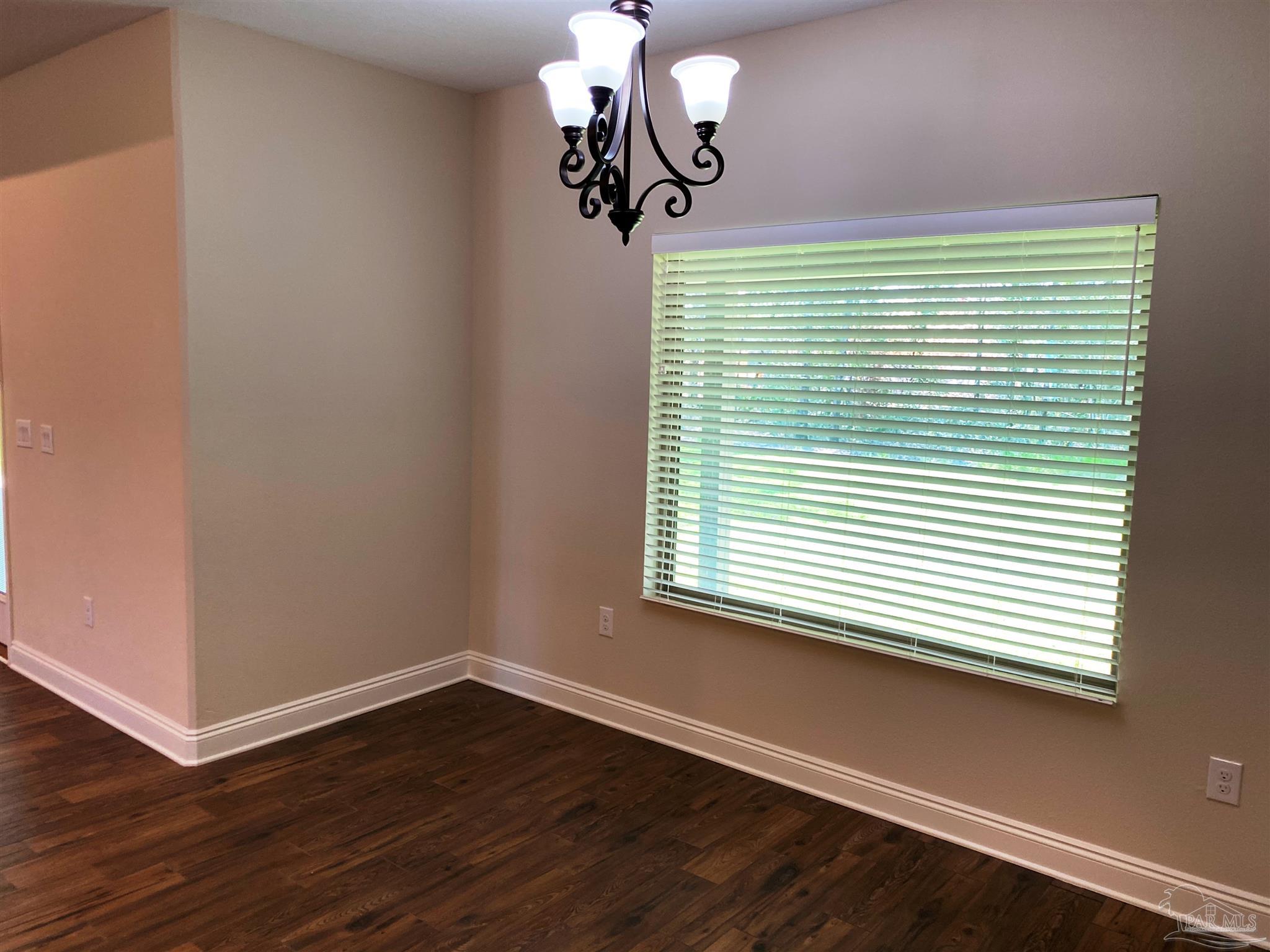 5472 South A Jones Road Milton, FL 32583 - Photo 12 of 29 The breakfast nook has views of the backyard.
