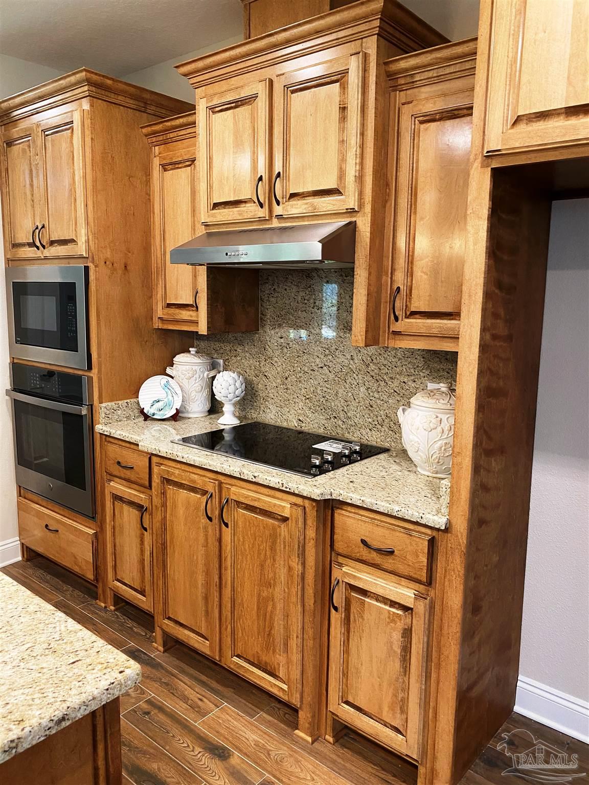 5472 South A Jones Road Milton, FL 32583 - Photo 3 of 29 Kitchen features a wall oven & separate cooktop.
