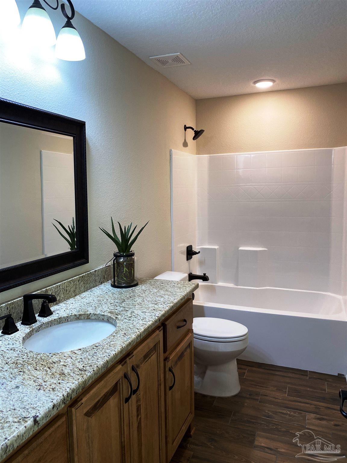5472 South A Jones Road Milton, FL 32583 - Photo 25 of 29 The 3rd full bath also has a shower/tub combo.