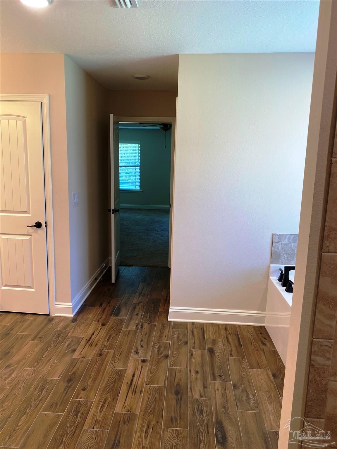 5472 South A Jones Road Milton, FL 32583 - Photo 6 of 29 A view of the master bath entry is seen here.