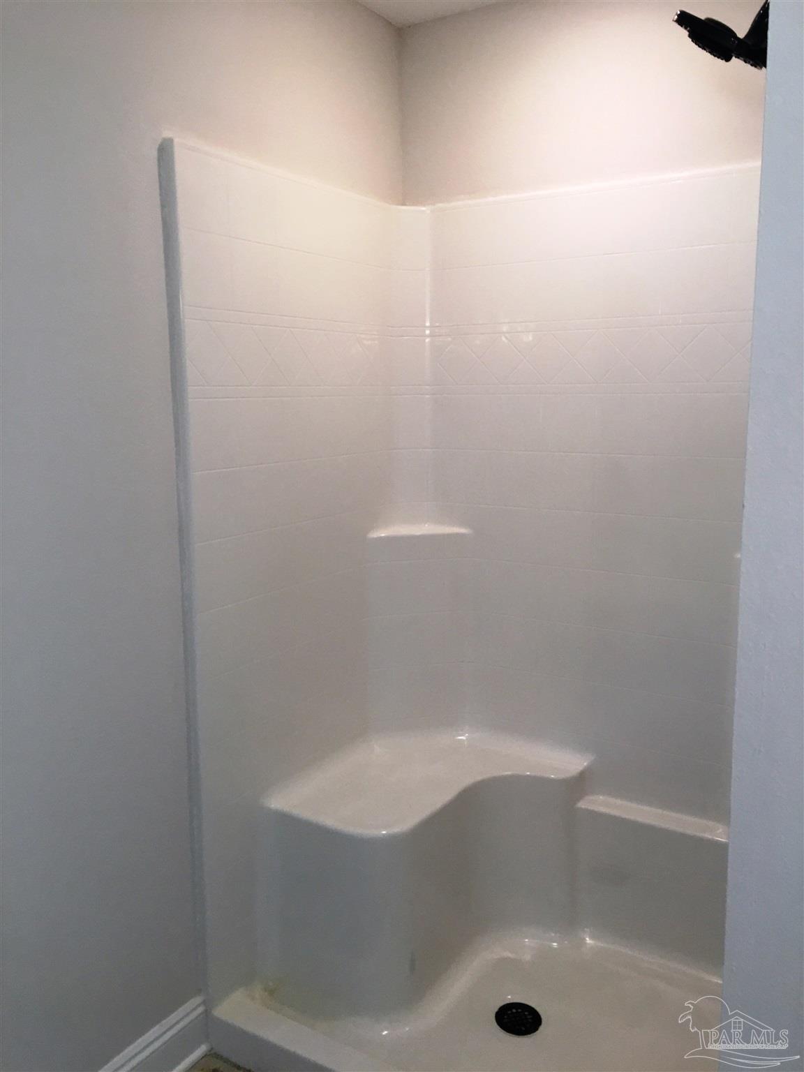 5472 South A Jones Road Milton, FL 32583 - Photo 8 of 29 Master bath has a fiberglass shower w/seat.