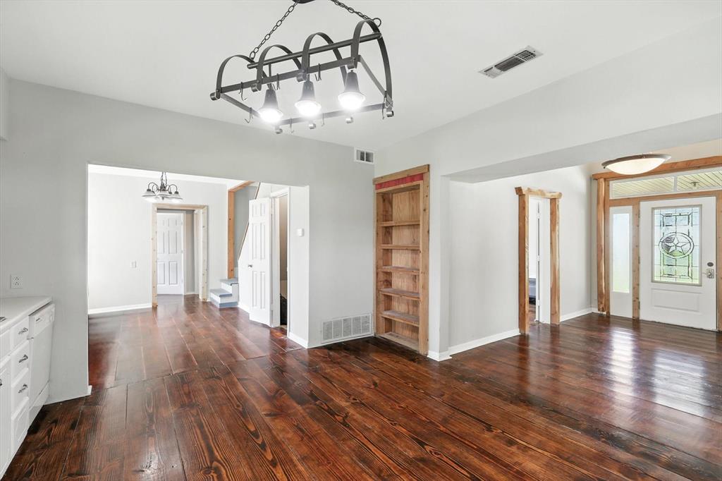 400 Katy Street Alba, TX 75410 - Photo 20 of 40 a view of an empty room with wooden floor and windows