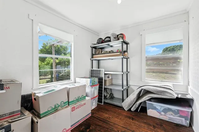 a bedroom with furniture and a window