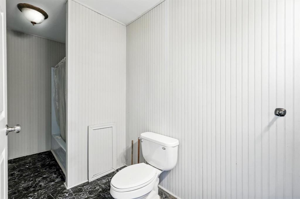 400 Katy Street Alba, TX 75410 - Photo 25 of 40 a white toilet sitting next to a shower