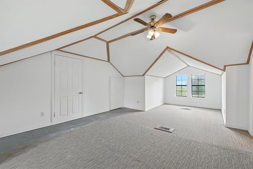 400 Katy Street Alba, TX 75410 - Photo 27 of 40 an empty room with windows and fan