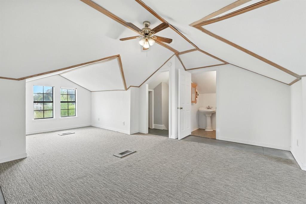 400 Katy Street Alba, TX 75410 - Photo 28 of 40 a view of a big room with wooden floor and windows