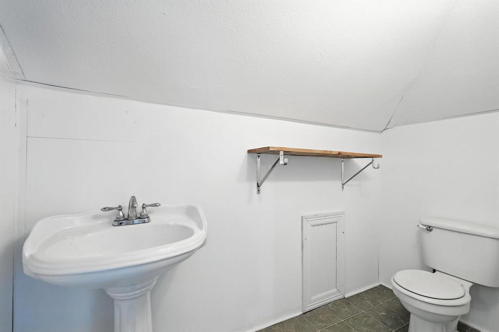 400 Katy Street Alba, TX 75410 - Photo 30 of 40 a bathroom with a sink a toilet and a mirror