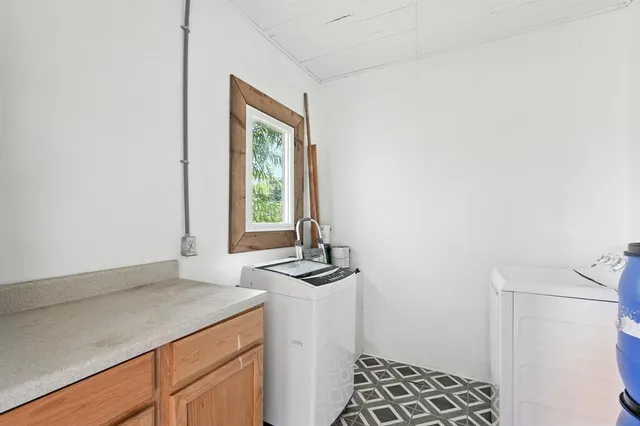 a kitchen with a sink and a window