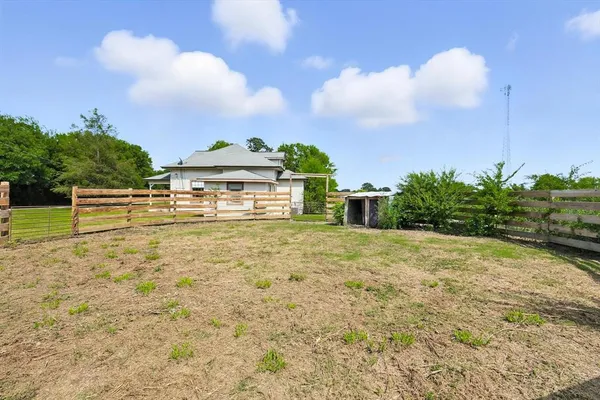 a view of a yard with an outdoor space