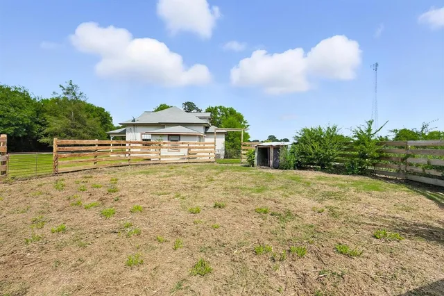 a view of a yard with an outdoor space