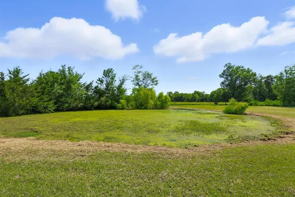 a view of a golf course with a lake