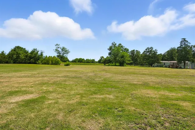 a view of a lake and a yard