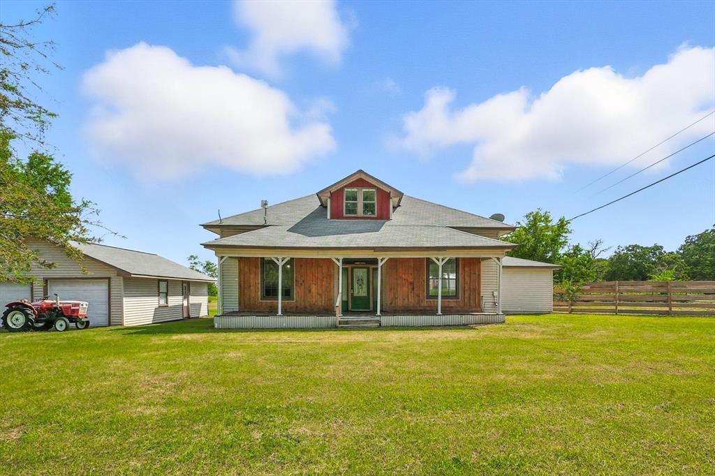 400 Katy Street Alba, TX 75410 - Photo 5 of 40 a front view of a house with a garden