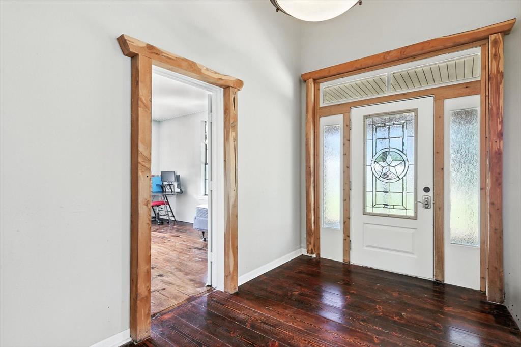 400 Katy Street Alba, TX 75410 - Photo 9 of 40 a view of a hallway with wooden floor and a living room