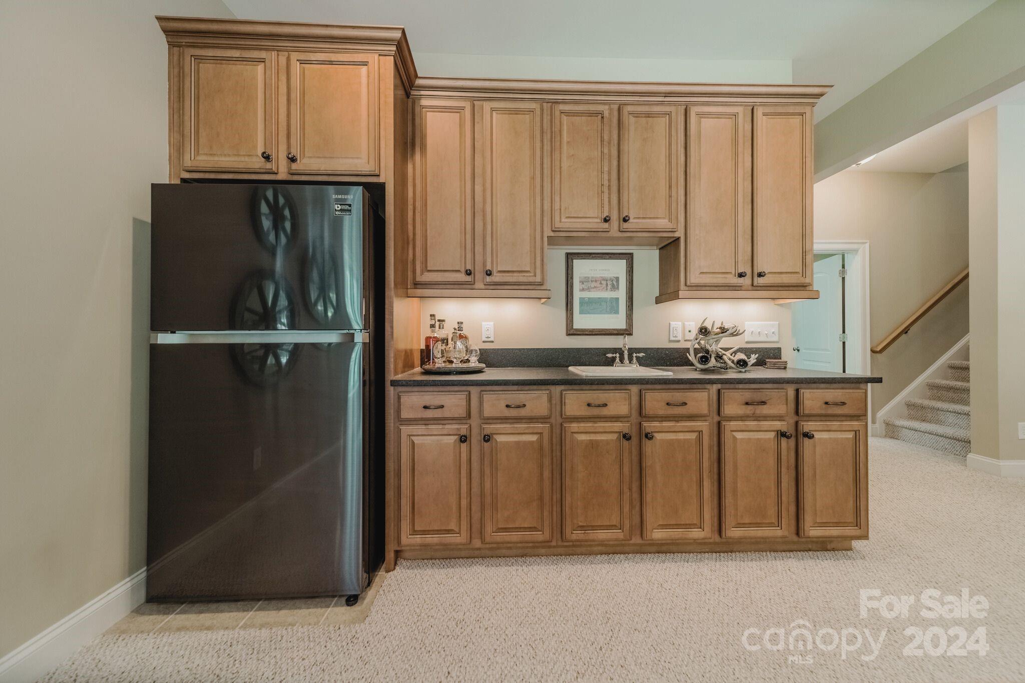 4273 Sailview Drive Denver, NC 28037 - Photo 14 of 39 a kitchen with white cabinets and refrigerator