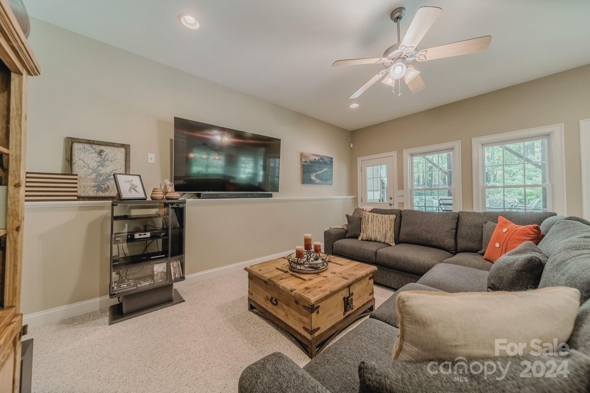 4273 Sailview Drive Denver, NC 28037 - Photo 15 of 39 a living room with furniture and a flat screen tv