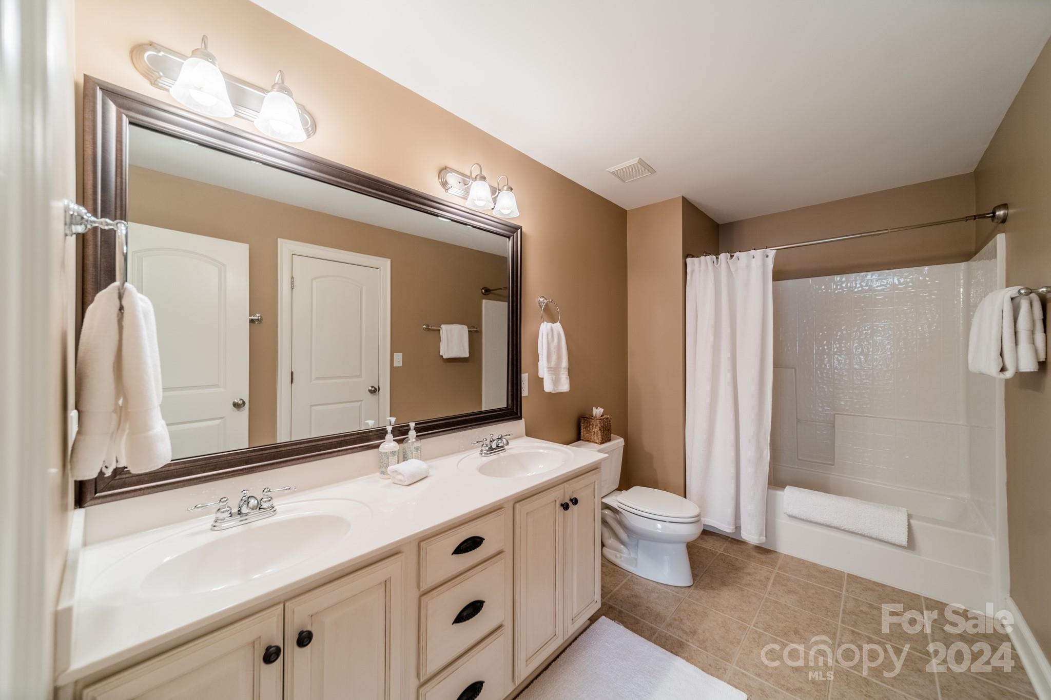 4273 Sailview Drive Denver, NC 28037 - Photo 19 of 39 a bathroom with a double vanity sink mirror and toilet