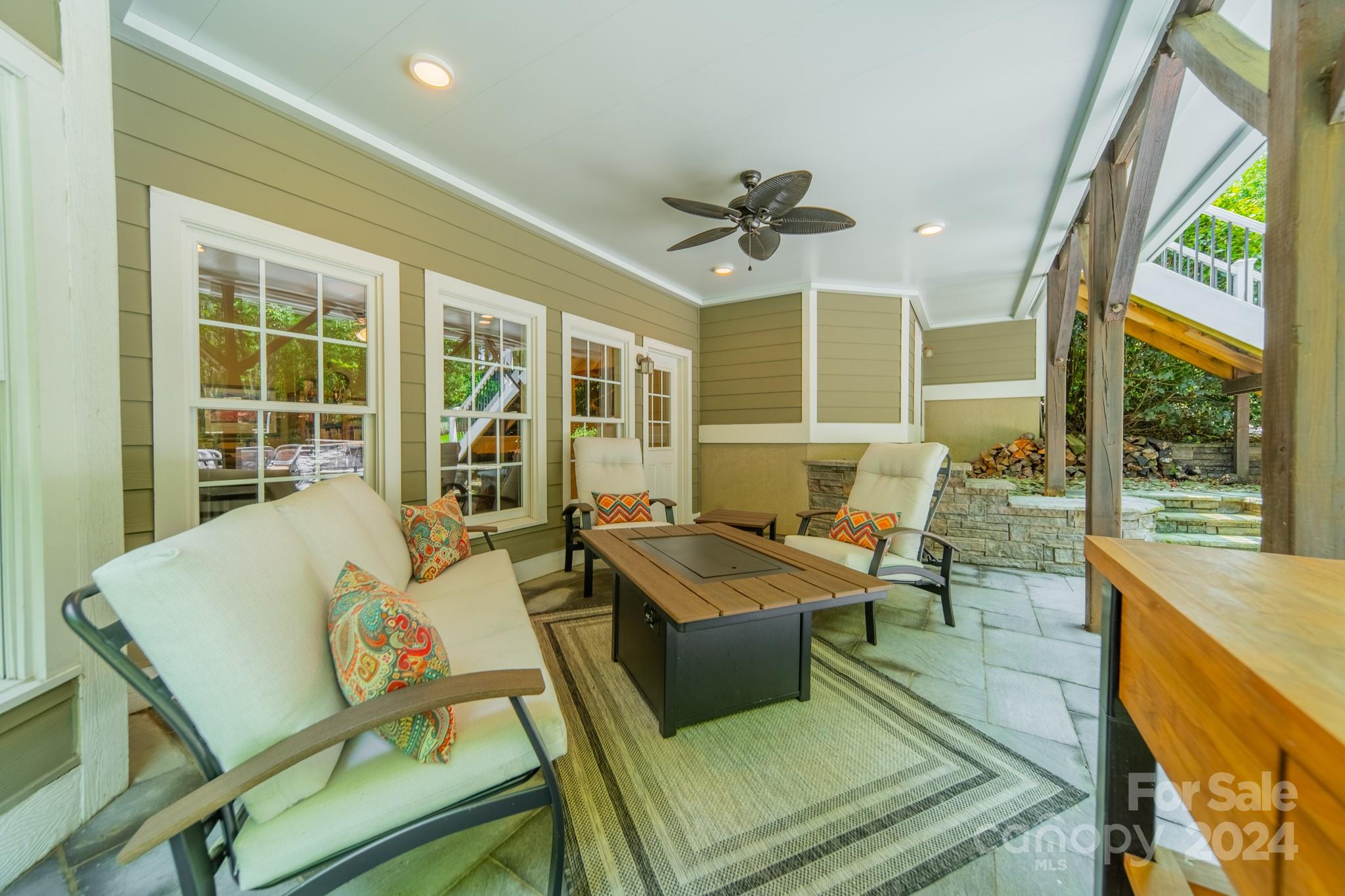 4273 Sailview Drive Denver, NC 28037 - Photo 25 of 39 a living room with furniture stove and a table
