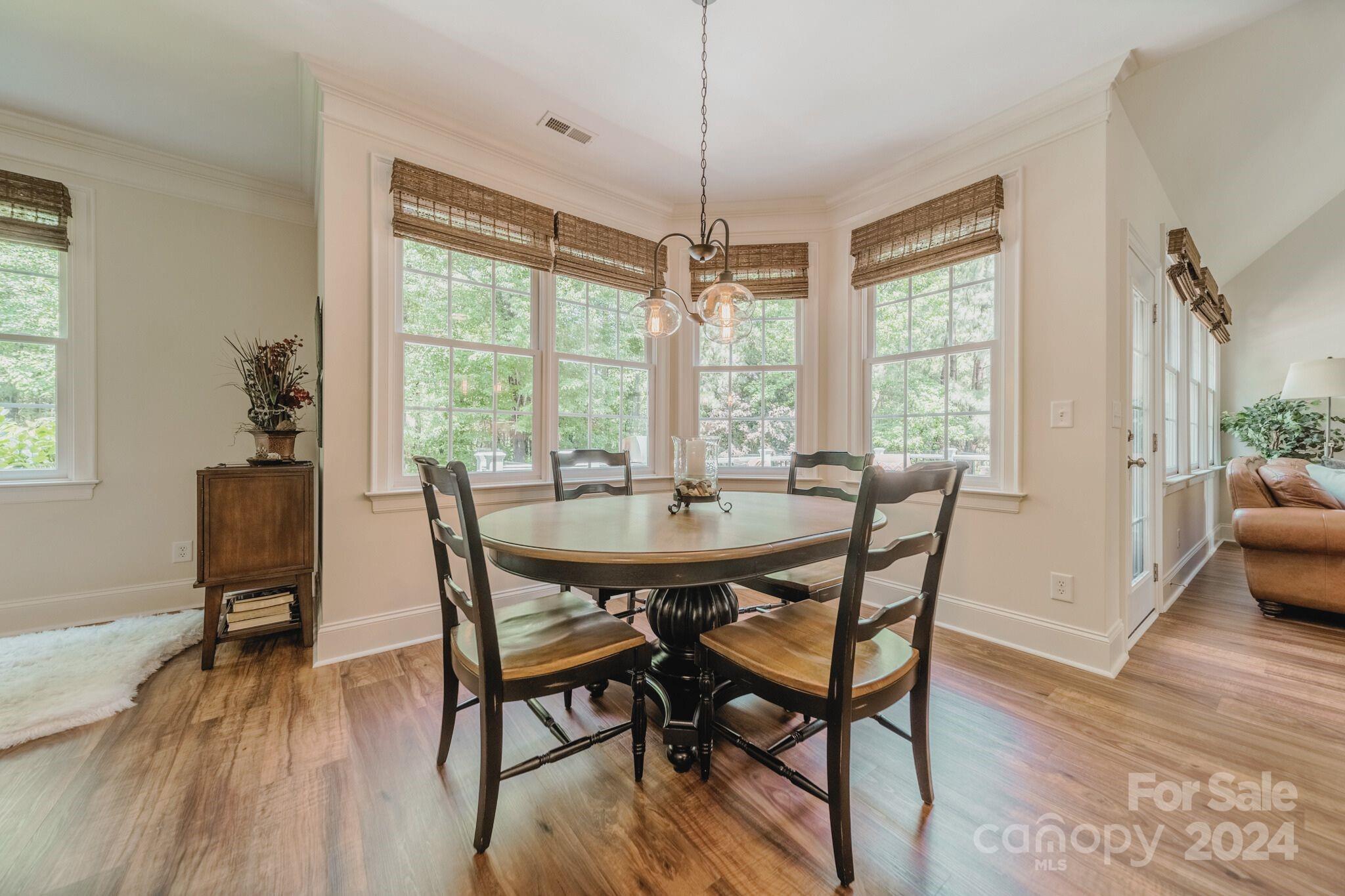 4273 Sailview Drive Denver, NC 28037 - Photo 6 of 39 a view of a dining room with furniture window and wooden floor