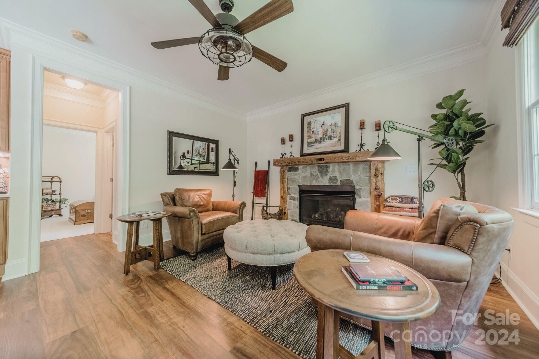 4273 Sailview Drive Denver, NC 28037 - Photo 7 of 39 a living room with furniture a table and a fireplace