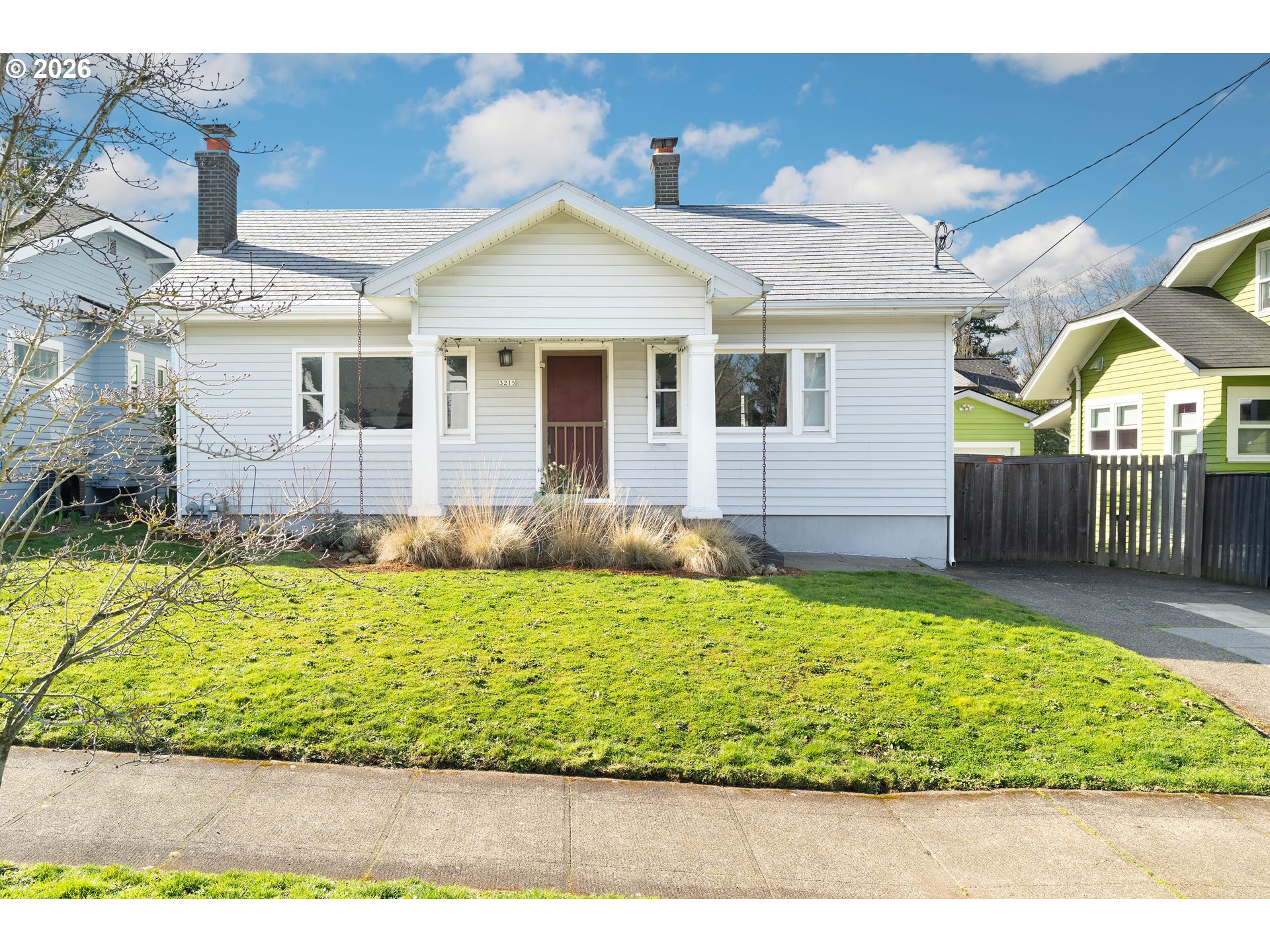 3215 Northeast 63rd Avenue Portland, OR 97213 - Photo 1 of 47 a front view of a house with a yard