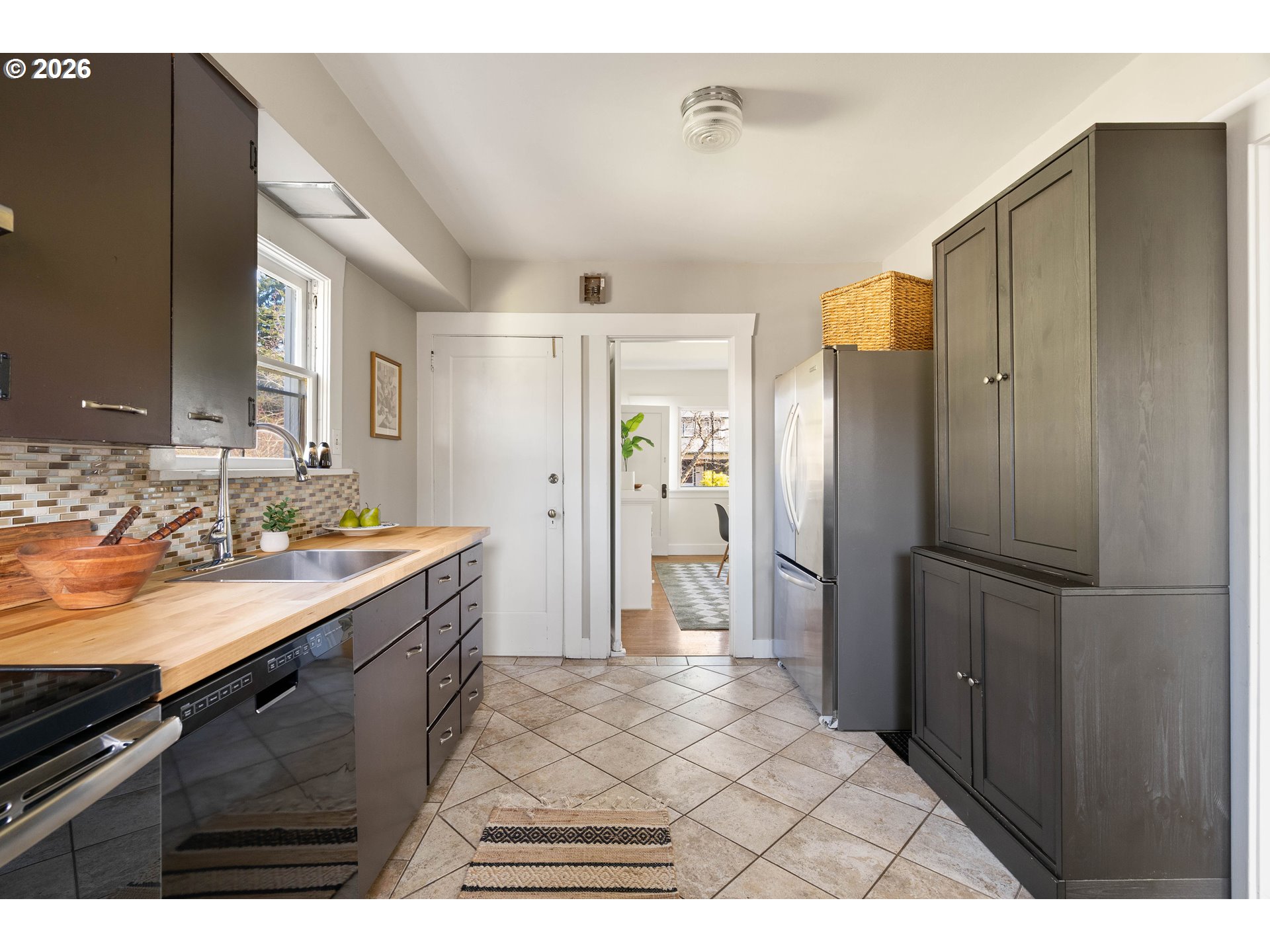 3215 Northeast 63rd Avenue Portland, OR 97213 - Photo 11 of 47 a kitchen with a refrigerator and a sink