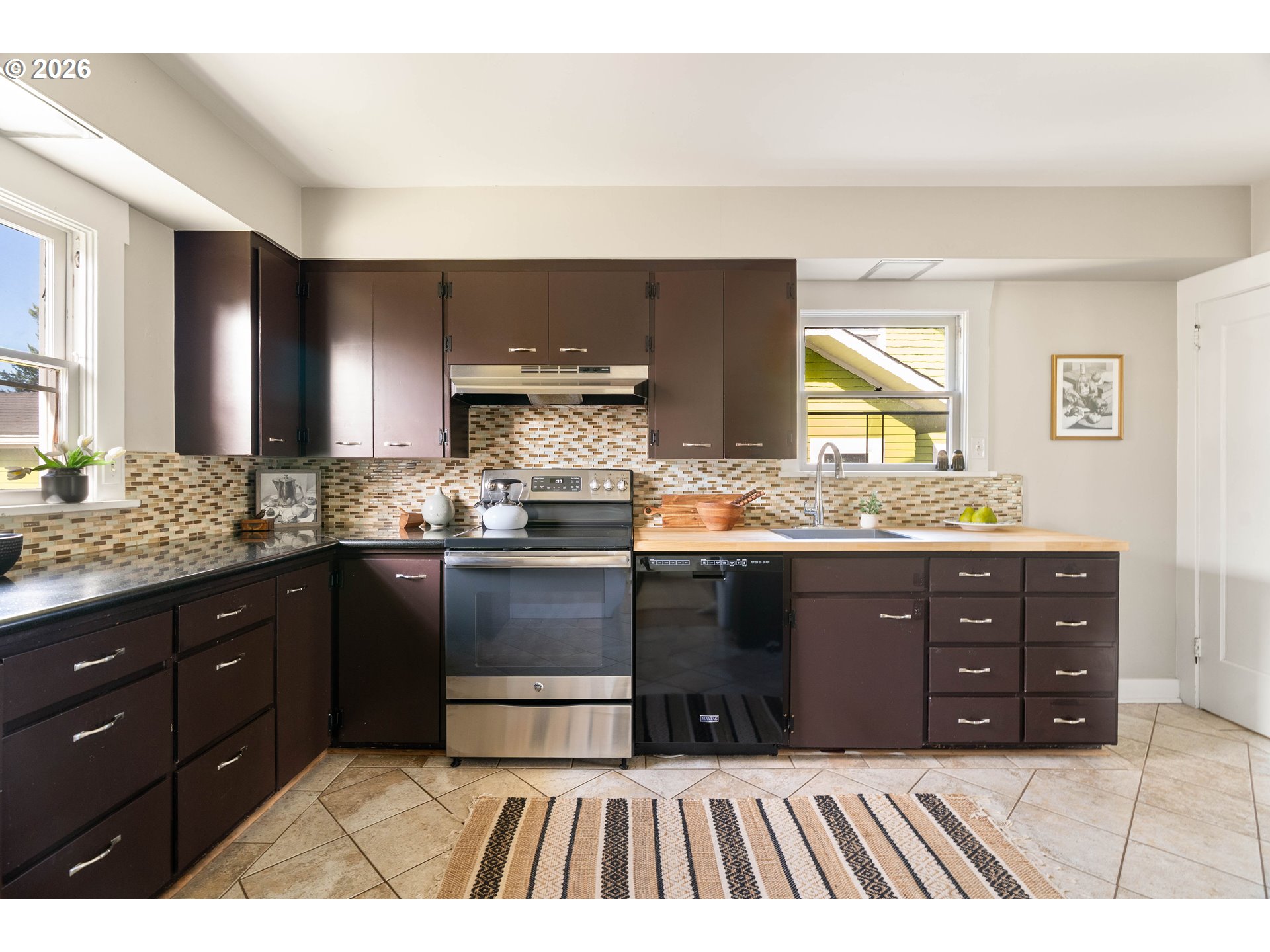 3215 Northeast 63rd Avenue Portland, OR 97213 - Photo 15 of 47 a kitchen with a sink and a wooden floor