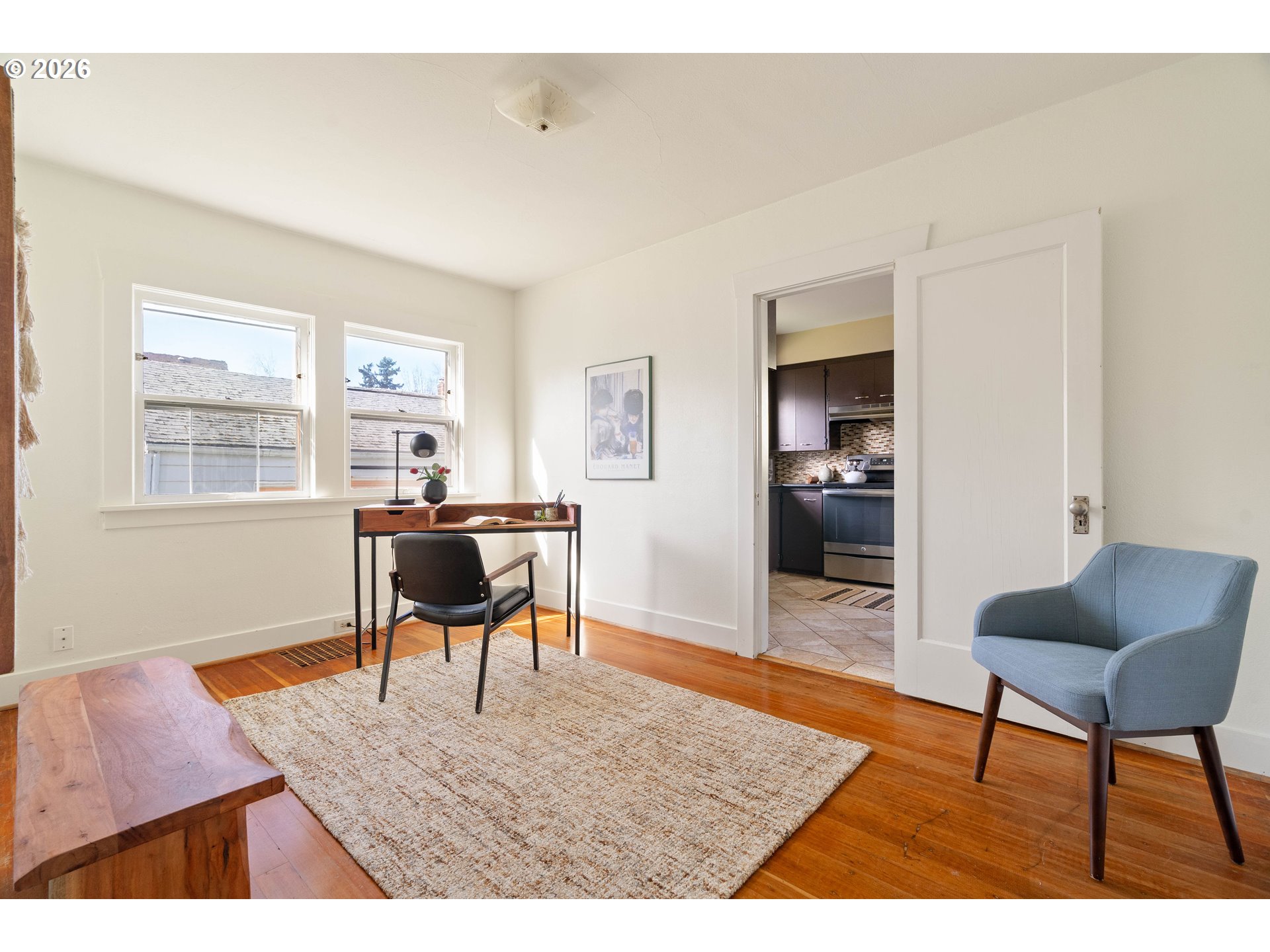 3215 Northeast 63rd Avenue Portland, OR 97213 - Photo 16 of 47 a living room with furniture and a wooden floor