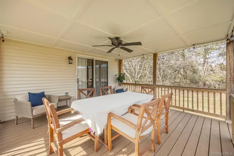a view of a patio with a table and chairs