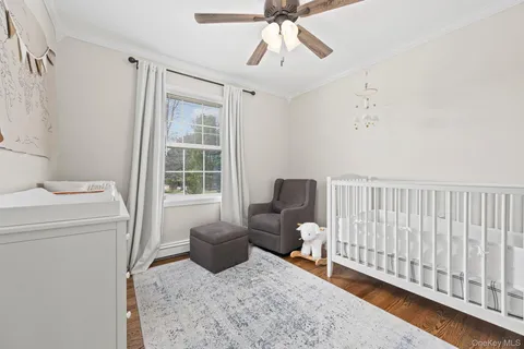 a bedroom with furniture and a window