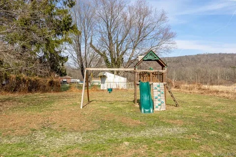 a view of yard with swimming pool