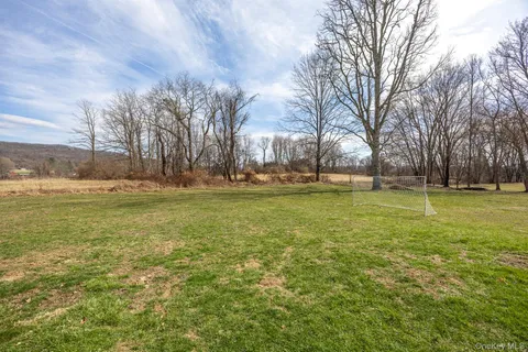 a view of a yard with a tree