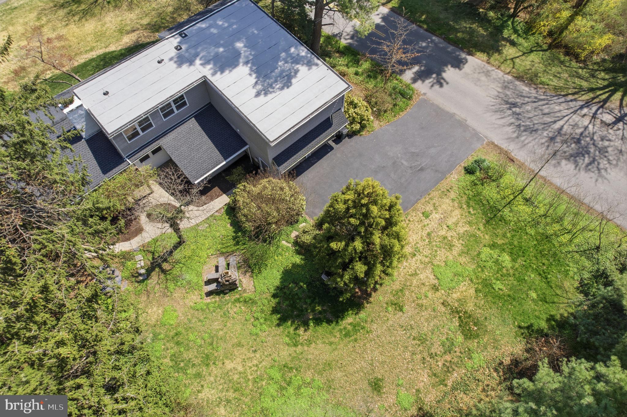 409 South Providence Road Wallingford, PA 19086 - Photo 98 of 106 Modern home nestled in lush greenery.