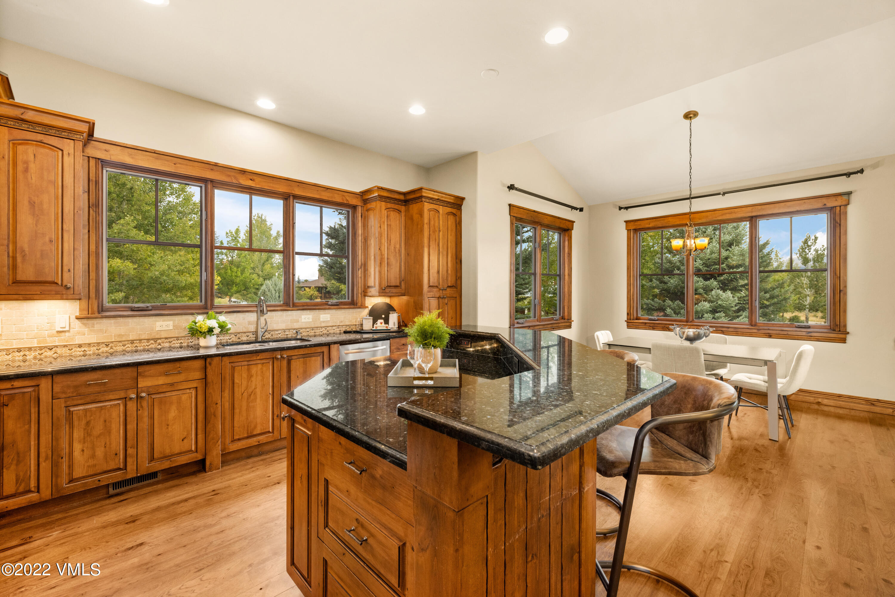 2376 Eagle Ranch Road Eagle, CO 81631 - Photo 12 of 52 a kitchen with granite countertop a sink and wooden cabinets