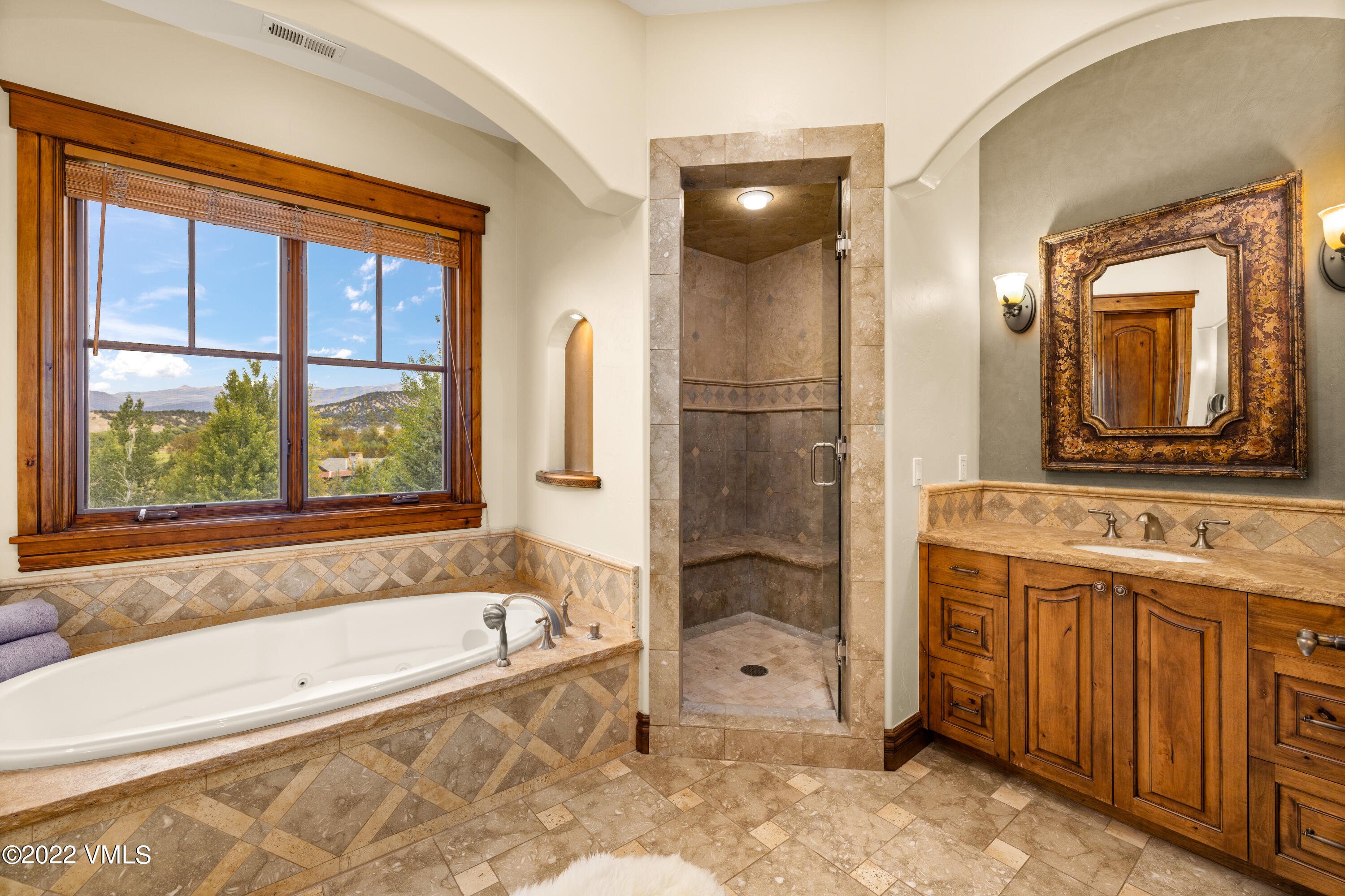 2376 Eagle Ranch Road Eagle, CO 81631 - Photo 20 of 52 a bathroom with a granite countertop tub sink and mirror