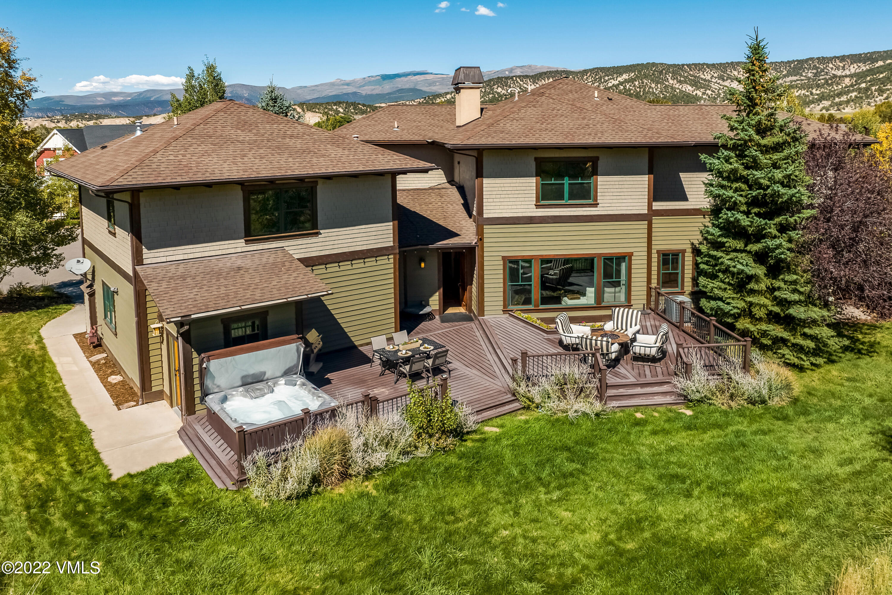 2376 Eagle Ranch Road Eagle, CO 81631 - Photo 21 of 52 a view of a patio with table and chairs under an umbrella