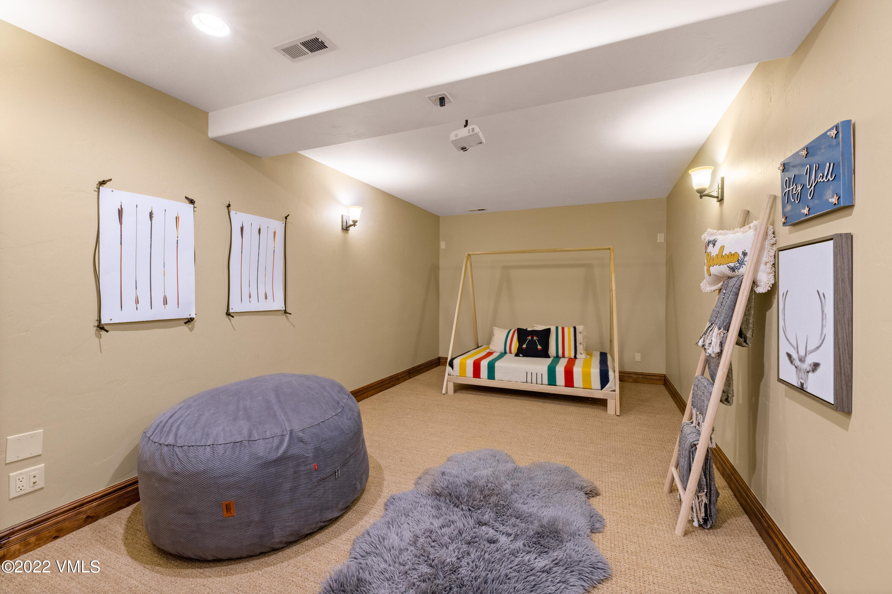 2376 Eagle Ranch Road Eagle, CO 81631 - Photo 33 of 52 a living room with furniture and a flat screen tv