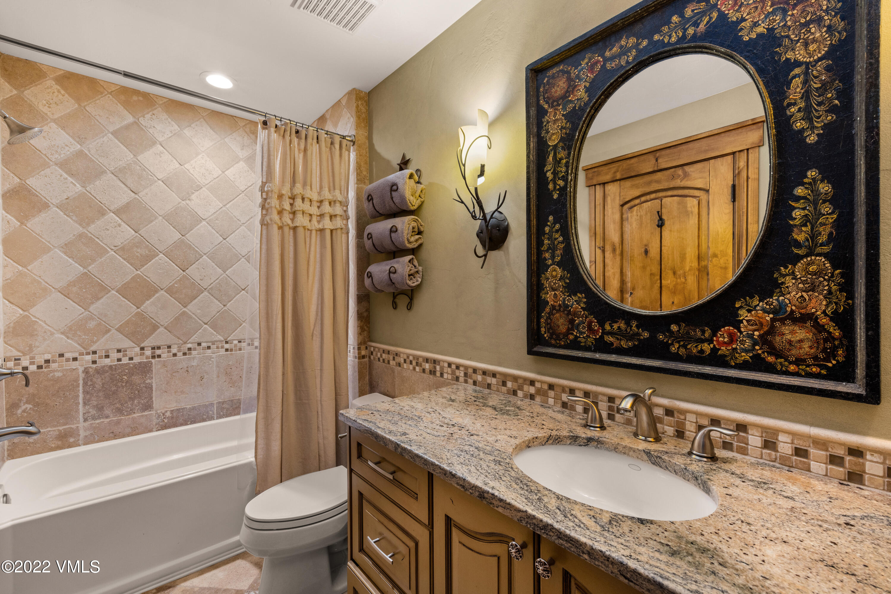 2376 Eagle Ranch Road Eagle, CO 81631 - Photo 35 of 52 a bathroom with a granite countertop sink mirror toilet and bathtub