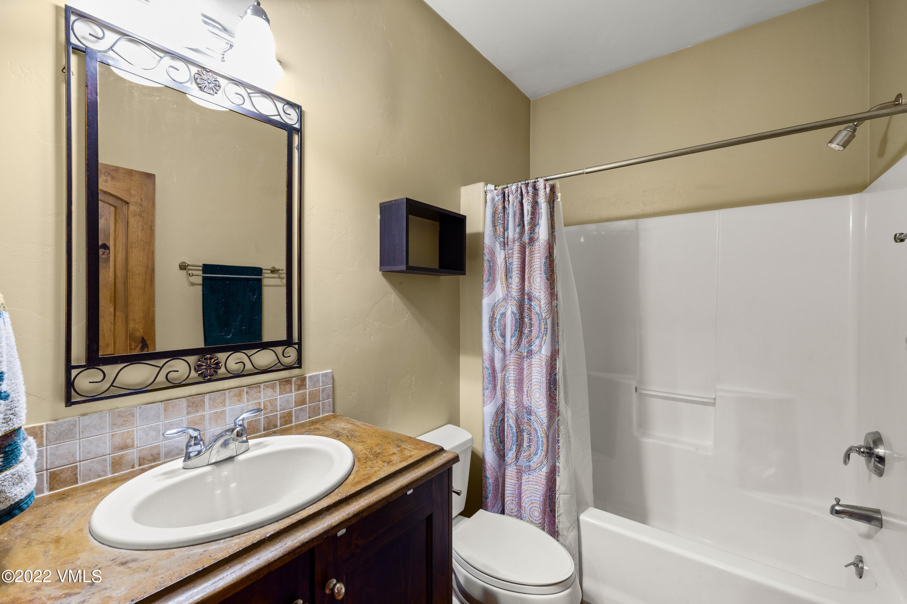 2376 Eagle Ranch Road Eagle, CO 81631 - Photo 36 of 52 a bathroom with a granite countertop sink toilet and shower