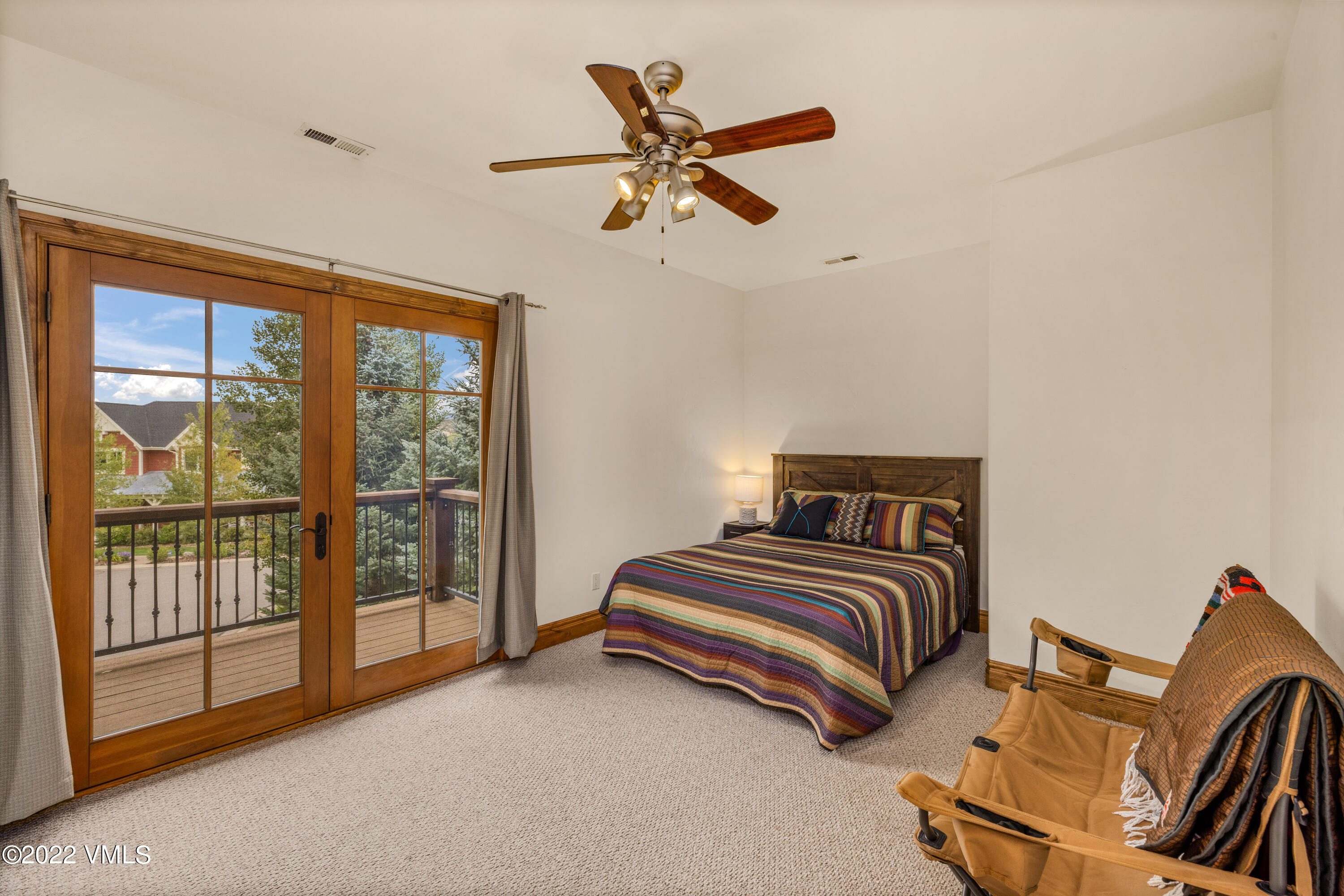 2376 Eagle Ranch Road Eagle, CO 81631 - Photo 37 of 52 a spacious bedroom with a bed and a window
