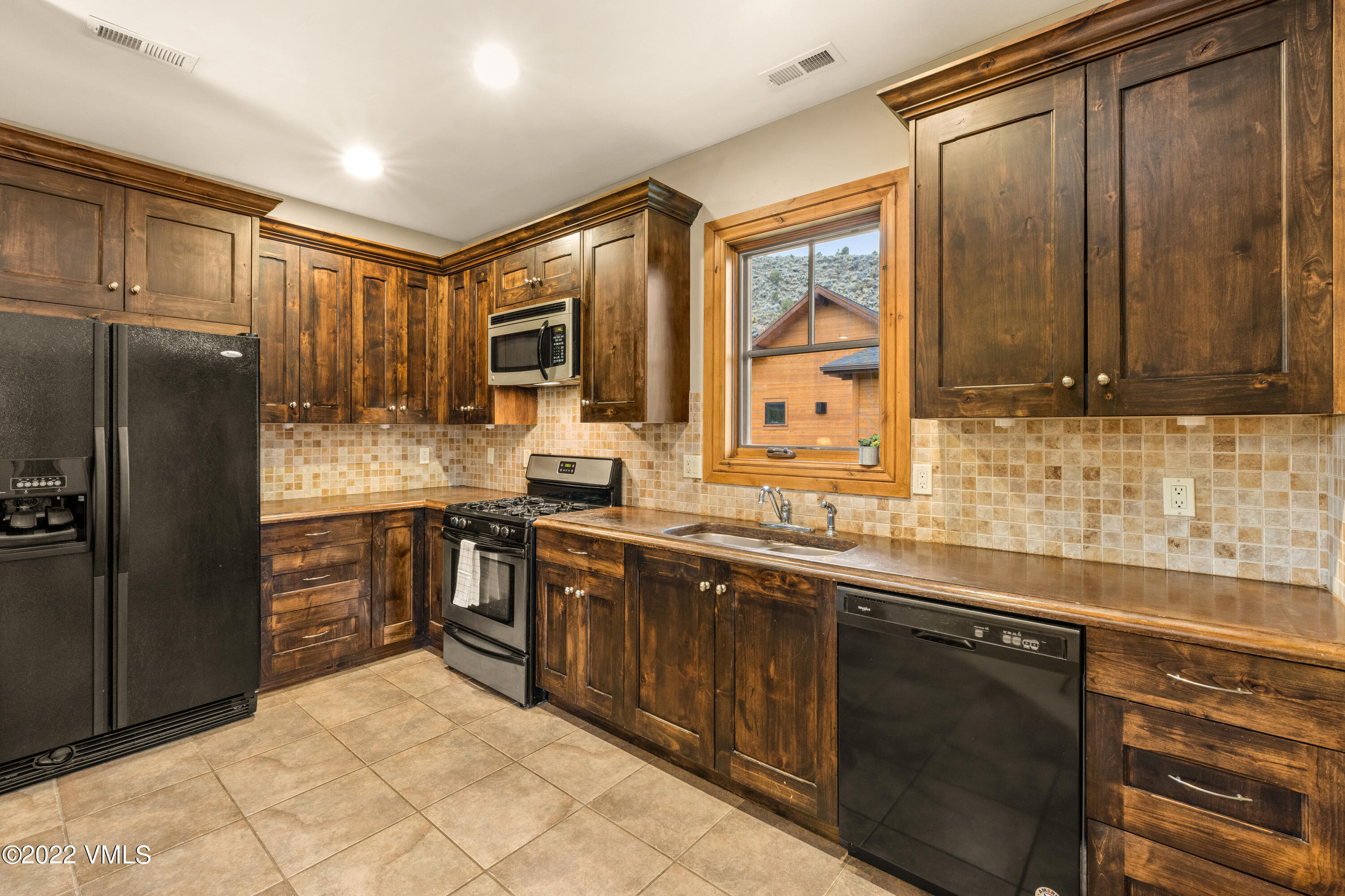 2376 Eagle Ranch Road Eagle, CO 81631 - Photo 39 of 52 a kitchen with stainless steel appliances granite countertop a refrigerator and a sink